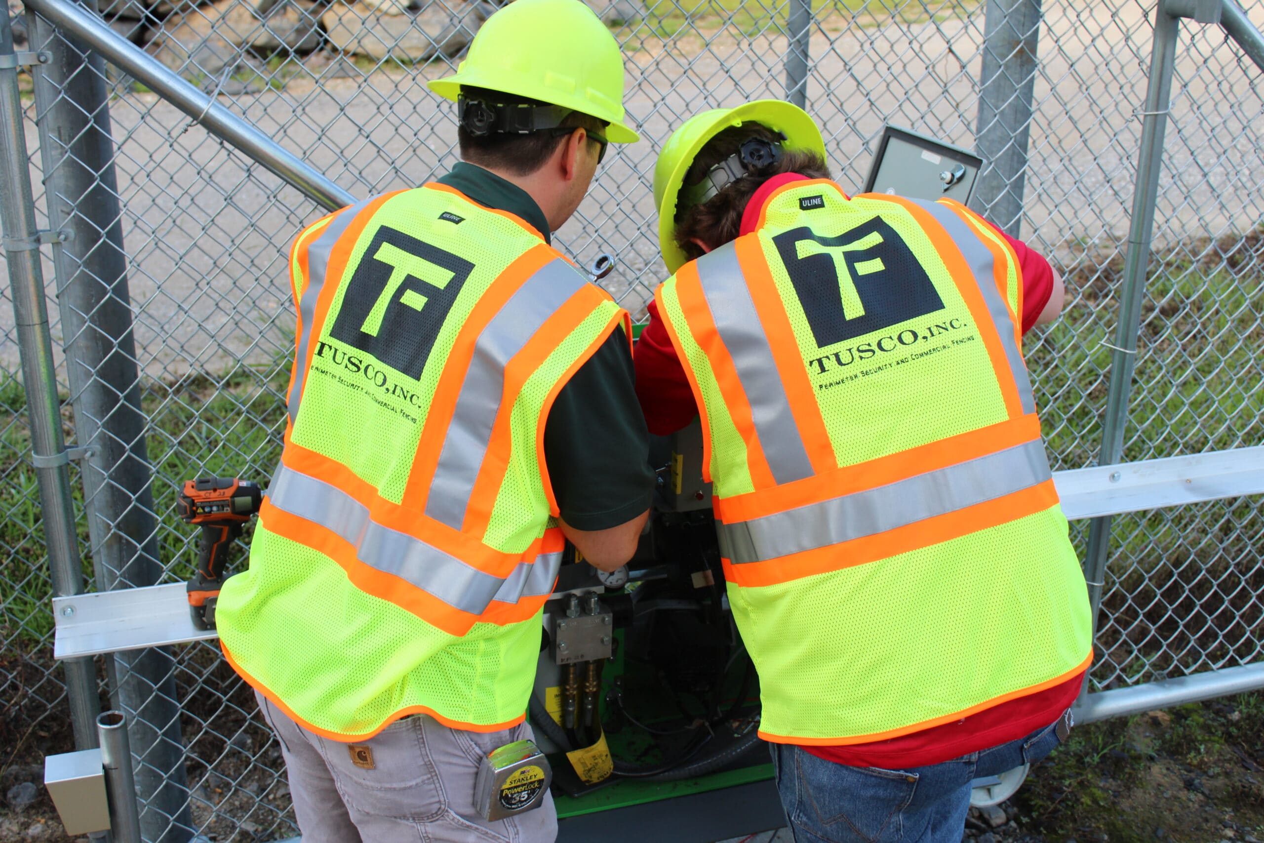 tusco employees installing security system