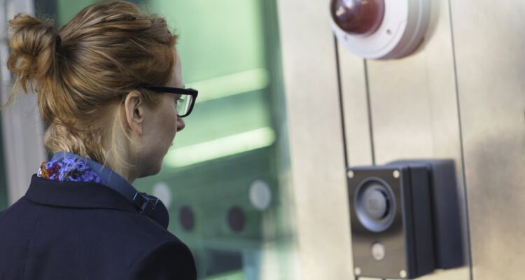 Woman Entering Building Using Electronic Security